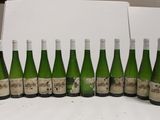 bottles of wine are lined up in a row on a table
