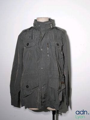 an image of a gray jacket on a mannequin stand