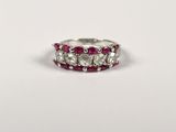 a close up of a ring with three stones on it