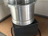 an image of a food processor sitting on a counter