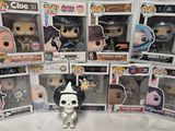 a lot of pop vinyl figures on display in the box