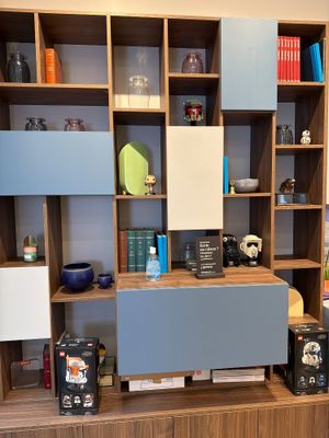 a shelf with many different items on it in a room