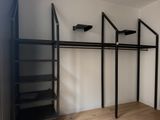 an image of a room with a shelf and shelves