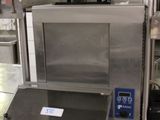 a machine that is sitting in the middle of a kitchen