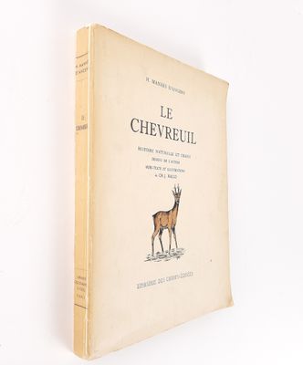 an old book with a picture of a deer on it ' s cover