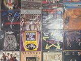 a lot of different album covers on the wall