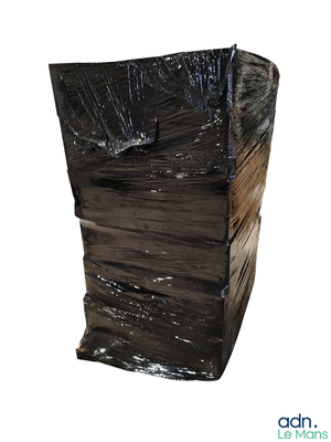 a picture of a black trash can wrapped in plastic