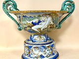 a large blue and white vase with a bird on it