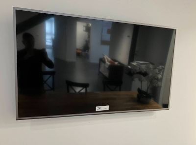 a large flat screen tv hanging on the wall