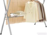 an image of a clothes rack with clothes hanging on it