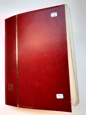 an image of a red book on a white surface