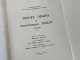 two open books sitting on a bed next to each other