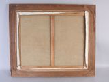an old wooden window frame with a window pane in the middle of it