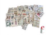 a pile of old newspapers sitting on top of each other