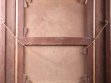 an old wooden door with a rope hanging from it ' s side