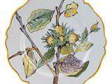 a plate with a painting of a bird on it