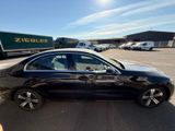 mercedes s - class sedan in a parking lot with a truck in the background