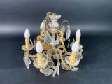 a close up of a chandelier on a black surface