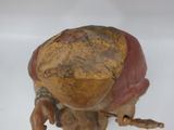 a figurine of a man with a hat on his head