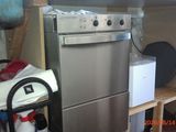 an image of a kitchen with a stove and a refrigerator