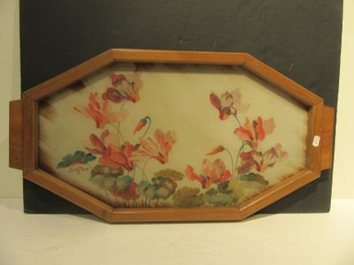 une photo d'un tableau représentant des fleurs, dans un cadre