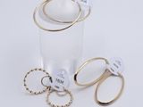 three rings and a ring holder on the table