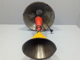 a close up of a metal bell on a table with a white background
