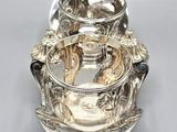 an antique silver plated teapot with a handle and a lid