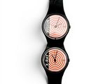 an image of a couple of watches sitting on top of each other