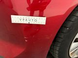 a red car with a sticker that says vpauto on it