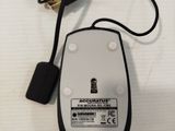 a computer mouse that is connected to a charger