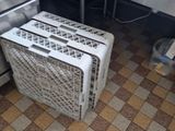 tiled floor in a commercial kitchen with stainless steel appliances and sink