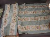an image of a bed with a blanket and a pillow