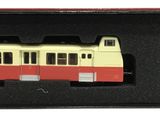 a toy train in a box with a plastic bag