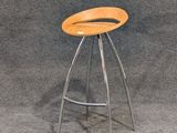 a stool with a wooden seat on a gray background