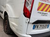 a white van that is parked on the side of the road