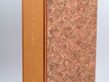 a book with a gold cover and a brown cover