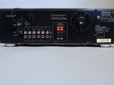 a close up of a black amplifier sitting on top of a table
