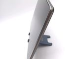 a close up of a cell phone on a stand