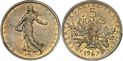 a close up of a coin with a woman on it
