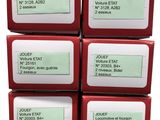 four boxes of red soap sitting on top of each other