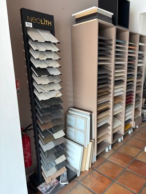 many shelves of tile in a room with a tv