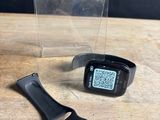 an image of a smart watch sitting on top of a wooden table