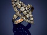 a close up of a diamond star ring on a blue background