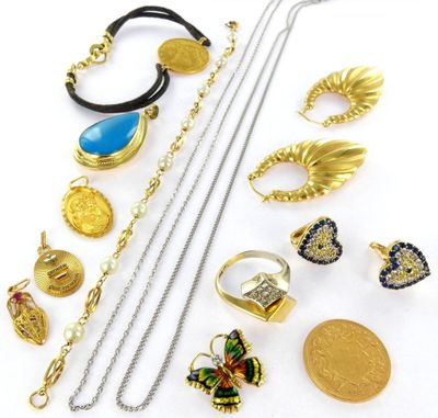 several different types of jewelry are arranged on a white surface