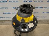 a close up of a machine with a hose on top of it