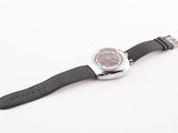 a watch that is sitting on a white surface