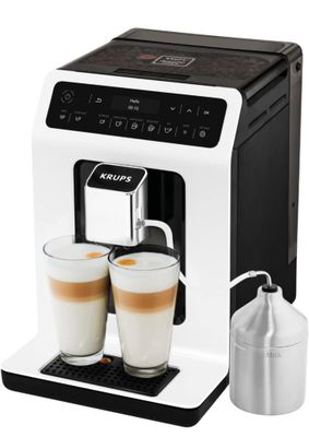 a close up of a coffee machine with two cups of coffee