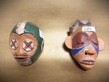 two masks that are sitting on a table
