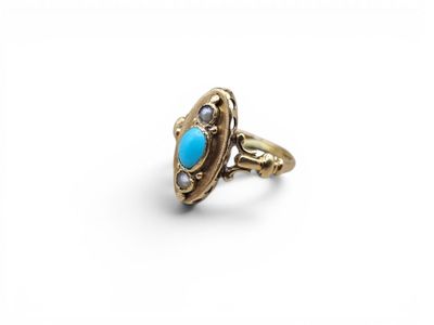 une image représentant une bague en or ornée d'une pierre turquoise au centre
